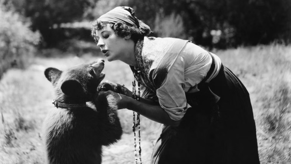 First Women of Hollywood: Female Pioneers in the Early Motion Picture Business presented by Mary Mallory Black and white photo of actress and writer Nell Shipman holding a baby bear